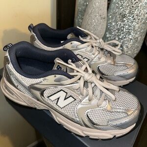 New Balance 530’s Color: metallic silver, cream, & white. SIZE: grade school 6